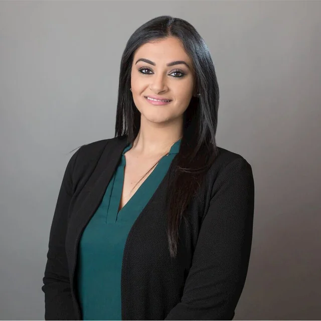 Attorney Marian Y. Saad in a black jacket and a green blouse
